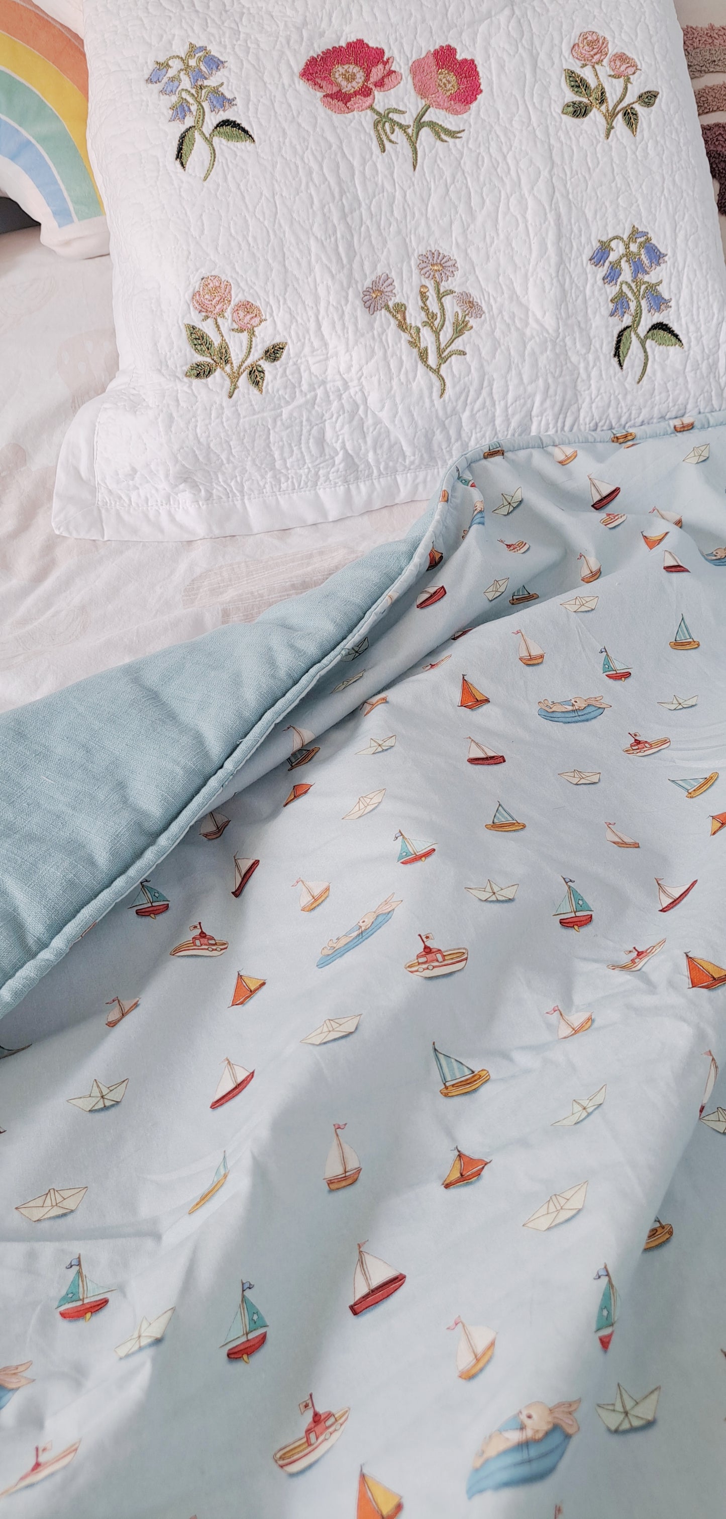 Squishy Belle and Boo Bunny in a boat and blue linen Fabric Quilt
