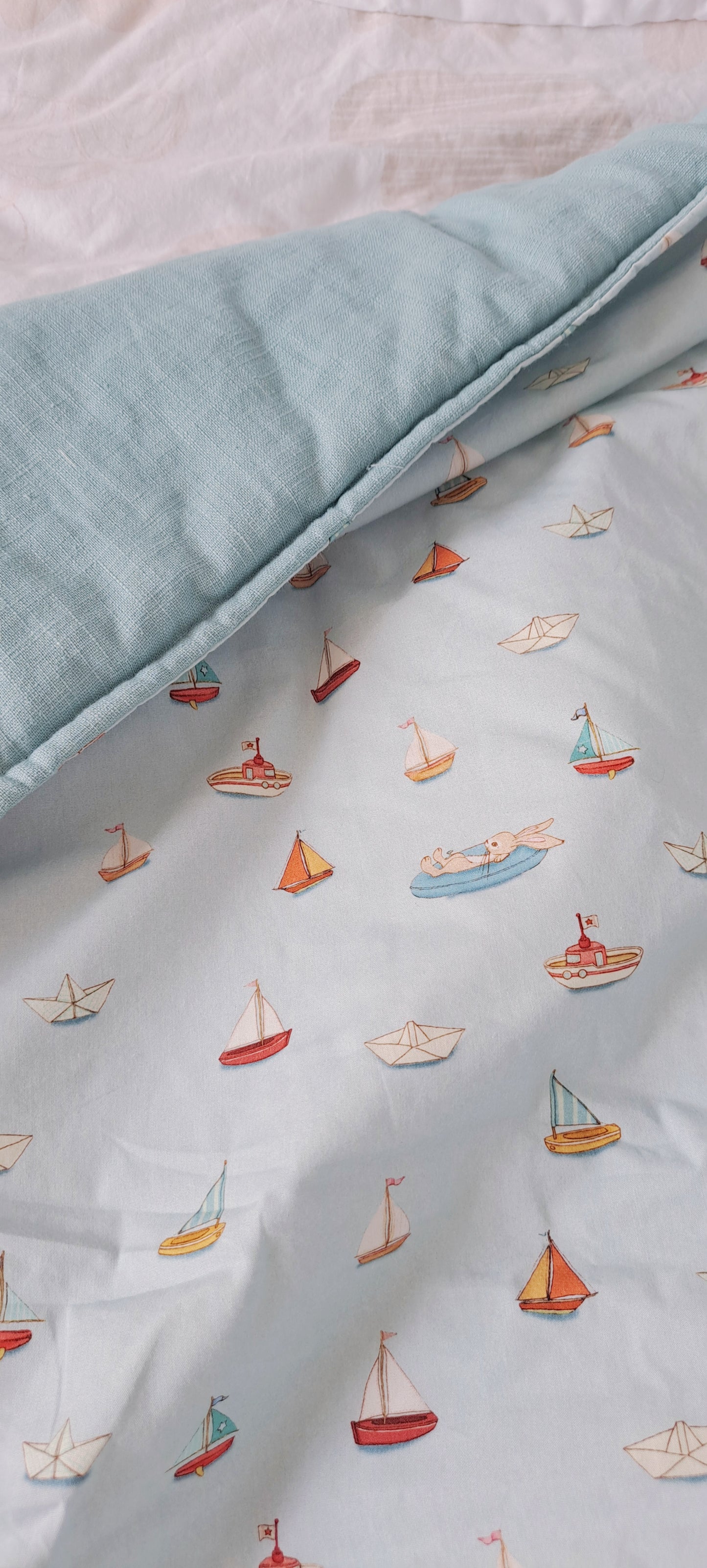 Squishy Belle and Boo Bunny in a boat and blue linen Fabric Quilt